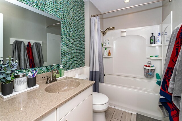405 Joy Cir, Gilbert, IA 50105 - bathroom featuring toilet, vanity, shower / bath combo, and wood finished floors