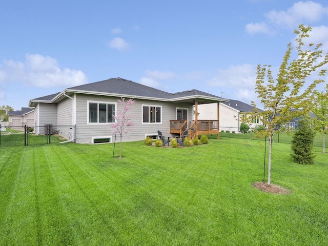 8876 Scarlet Dr, West Des Moines, IA 50266 - back of property featuring a deck, a gate, and a shingled roof