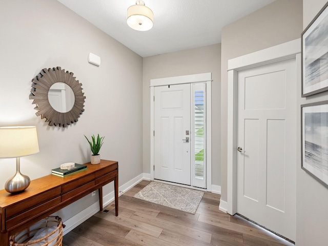 8876 Scarlet Dr, West Des Moines, IA 50266 - entrance foyer featuring wood finished floors and baseboards