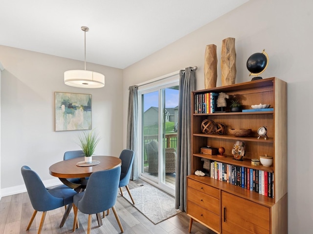 8876 Scarlet Dr, West Des Moines, IA 50266 - dining room featuring light wood-style floors and baseboards
