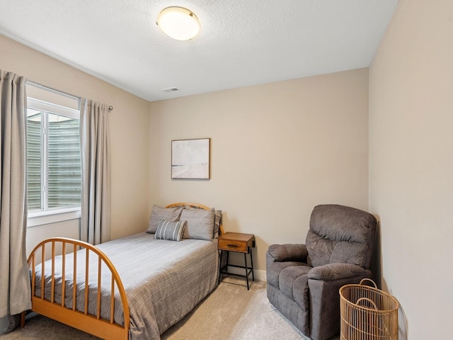 8876 Scarlet Dr, West Des Moines, IA 50266 - carpeted bedroom with a textured ceiling