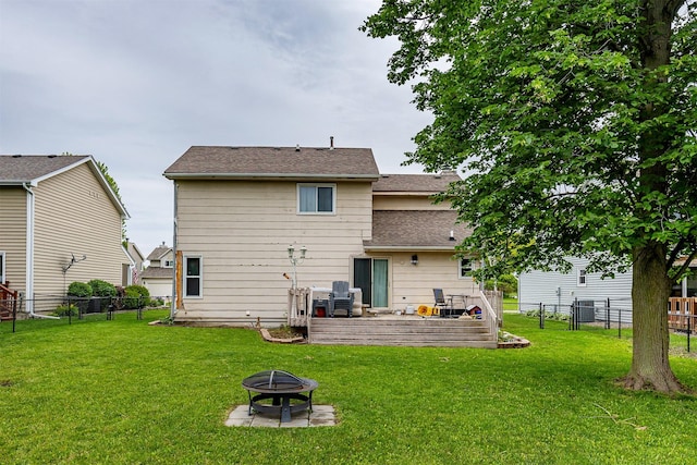 1212 8th Ave SE, Altoona, IA 50009 - back of house with an outdoor fire pit and a shingled roof