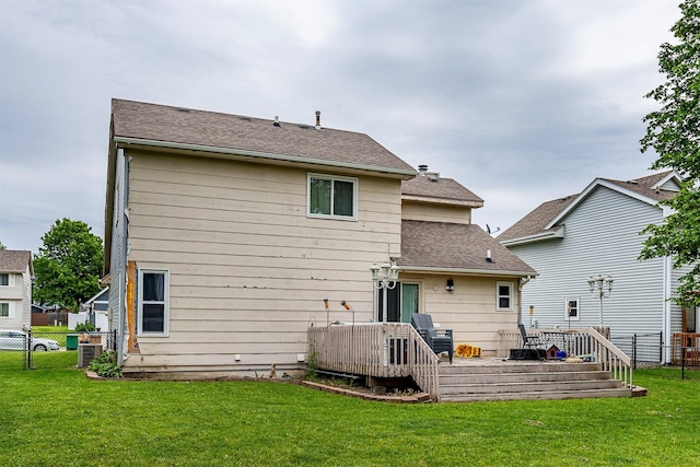 1212 8th Ave SE, Altoona, IA 50009 - back of house featuring a deck, roof with shingles, and central AC