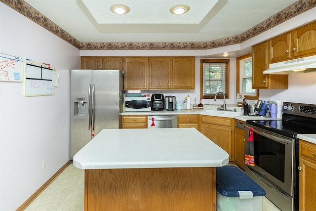 1212 8th Ave SE, Altoona, IA 50009 - kitchen with appliances with stainless steel finishes, under cabinet range hood, a sink, light countertops, and light floors