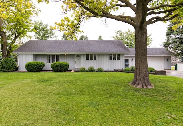 203 11th St, Dallas Center, IA 50063 - ranch-style home with a front yard, an attached garage, and driveway