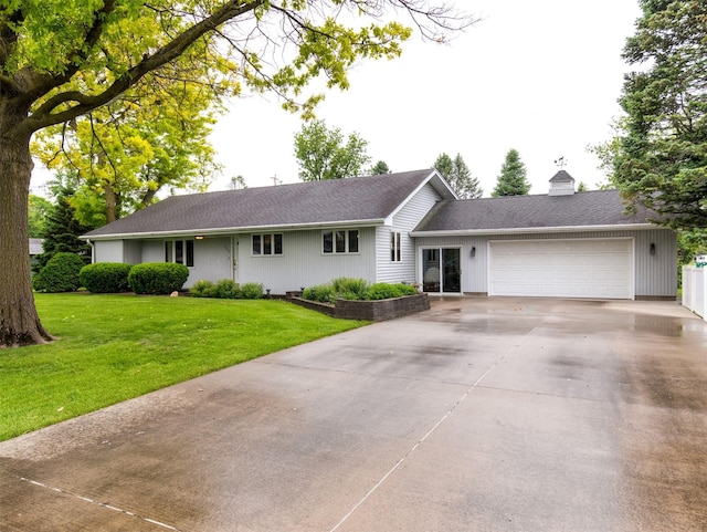 203 11th St, Dallas Center, IA 50063 - single story home featuring an attached garage, driveway, a chimney, a front lawn, and a shingled roof
