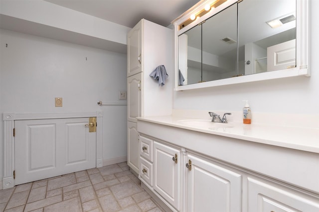 203 11th St, Dallas Center, IA 50063 - full bath featuring vanity and baseboards