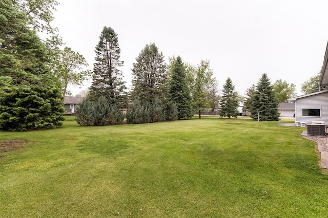203 11th St, Dallas Center, IA 50063 - view of grassy yard featuring central AC