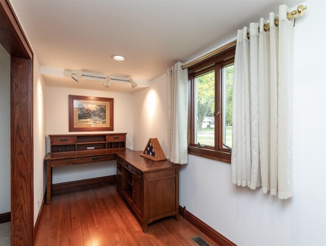 203 11th St, Dallas Center, IA 50063 - office featuring baseboards, wood finished floors, rail lighting, and recessed lighting