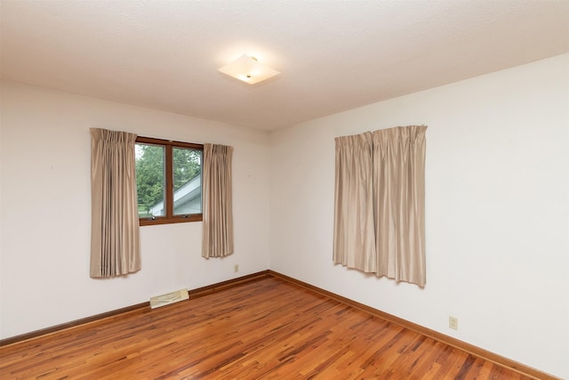 203 11th St, Dallas Center, IA 50063 - empty room with light wood finished floors and baseboards