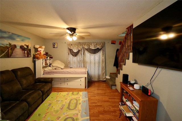 1929 10th St, Des Moines, IA 50314 - bedroom with wood finished floors and a ceiling fan