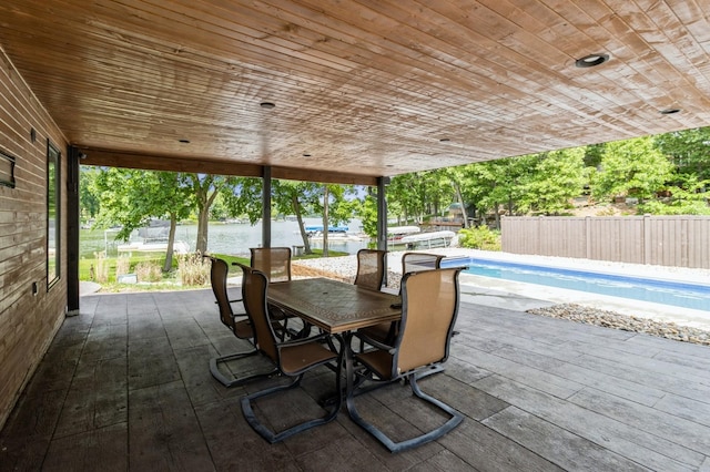 105 S Shore Dr, Montezuma, IA 50171 - view of patio / terrace with outdoor dining space and a deck with water view