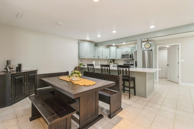 105 S Shore Dr, Montezuma, IA 50171 - dining space with light tile patterned floors and recessed lighting