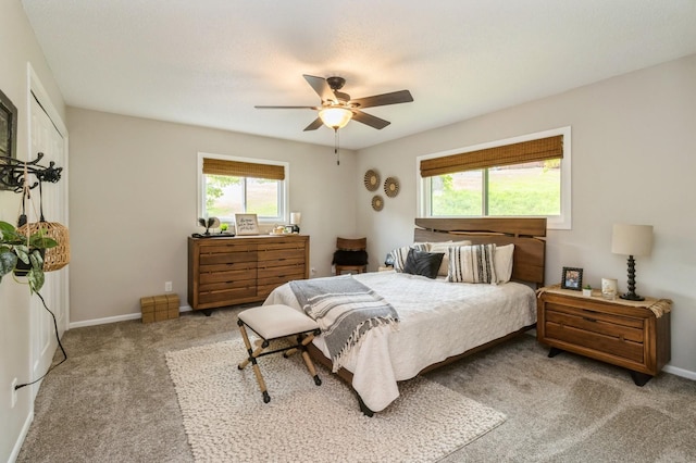105 S Shore Dr, Montezuma, IA 50171 - bedroom featuring carpet, baseboards, and a ceiling fan