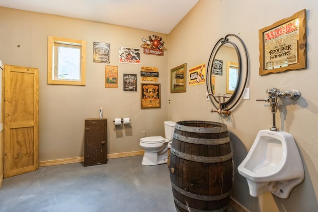 105 S Shore Dr, Montezuma, IA 50171 - bathroom with finished concrete floors, toilet, a bidet, and baseboards
