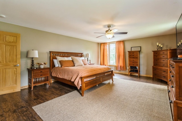 105 S Shore Dr, Montezuma, IA 50171 - bedroom featuring wood finished floors, a ceiling fan, and baseboards