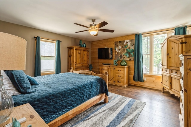 105 S Shore Dr, Montezuma, IA 50171 - bedroom featuring multiple windows, wood-type flooring, and ceiling fan