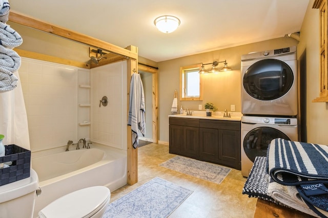 105 S Shore Dr, Montezuma, IA 50171 - bathroom with stacked washing machine and dryer, toilet, shower / tub combo with curtain, and double vanity