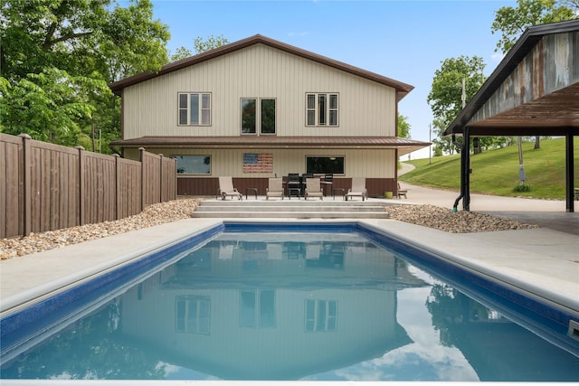 105 S Shore Dr, Montezuma, IA 50171 - rear view of house featuring a patio