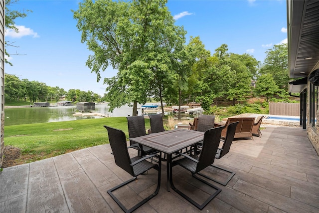 105 S Shore Dr, Montezuma, IA 50171 - view of patio / terrace featuring a water view and outdoor dining space