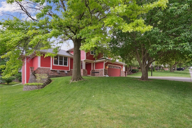 1645 NW 101st St, Clive, IA 50325 - view of front of house with a garage, a front yard, and stone siding