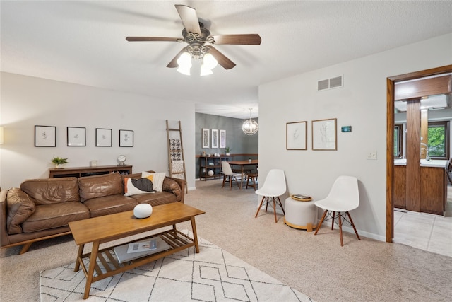 1645 NW 101st St, Clive, IA 50325 - living room featuring light carpet, a ceiling fan, and baseboards