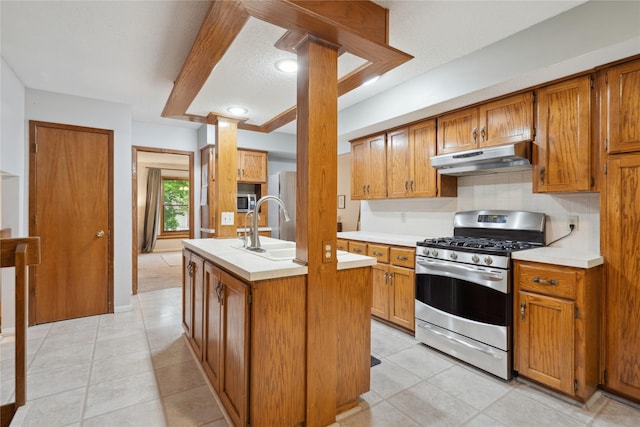 1645 NW 101st St, Clive, IA 50325 - kitchen with stainless steel appliances, under cabinet range hood, light countertops, backsplash, and a center island with sink