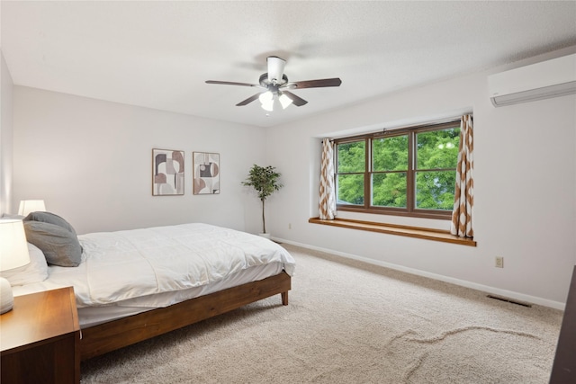 1645 NW 101st St, Clive, IA 50325 - carpeted bedroom featuring a wall unit AC, baseboards, and ceiling fan