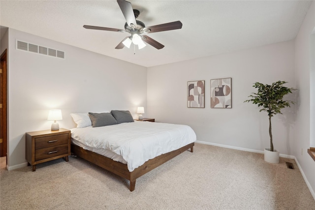1645 NW 101st St, Clive, IA 50325 - bedroom with light carpet, baseboards, and ceiling fan