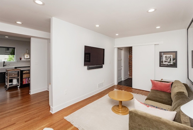 2606 Forest Dr, Des Moines, IA 50312 - living room with wood finished floors and recessed lighting