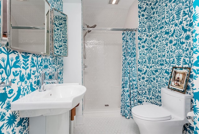 2606 Forest Dr, Des Moines, IA 50312 - full bathroom with wallpapered walls, a stall shower, and tile patterned floors
