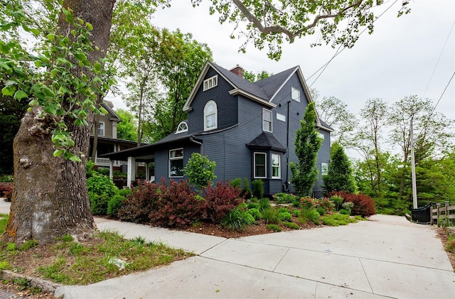 2606 Forest Dr, Des Moines, IA 50312 - view of side of property with a chimney