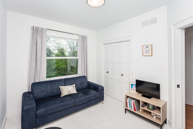 2606 Forest Dr, Des Moines, IA 50312 - carpeted living area featuring baseboards