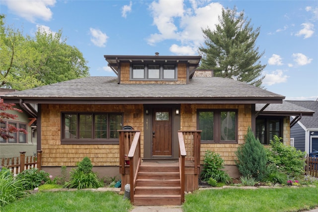 1439 46th St, Des Moines, IA 50311 - view of front facade featuring a shingled roof