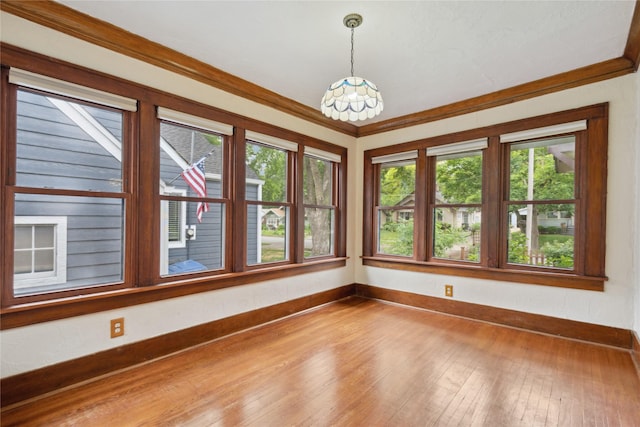 1439 46th St, Des Moines, IA 50311 - unfurnished room with a chandelier, baseboards, hardwood / wood-style floors, and ornamental molding