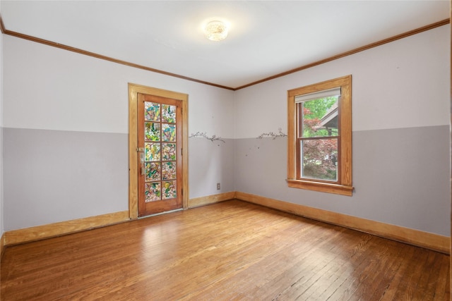 1439 46th St, Des Moines, IA 50311 - spare room featuring hardwood / wood-style floors, crown molding, and baseboards