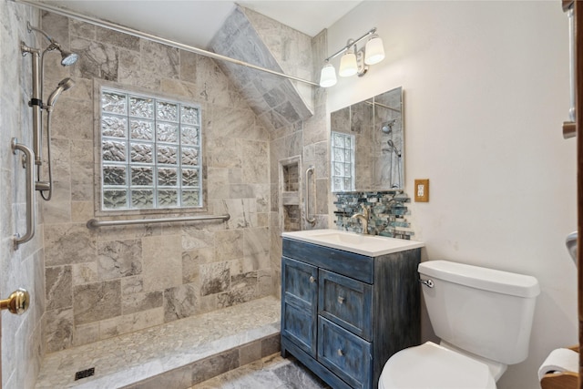 1439 46th St, Des Moines, IA 50311 - full bath featuring toilet, vanity, and tiled shower
