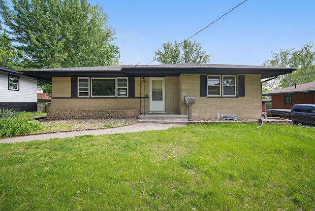 2407 E Tiffin Ave, Des Moines, IA 50317 - view of front of house with brick siding and a front yard