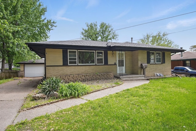 2407 E Tiffin Ave, Des Moines, IA 50317 - view of front of home featuring brick siding, asphalt driveway, a garage, and roof with shingles
