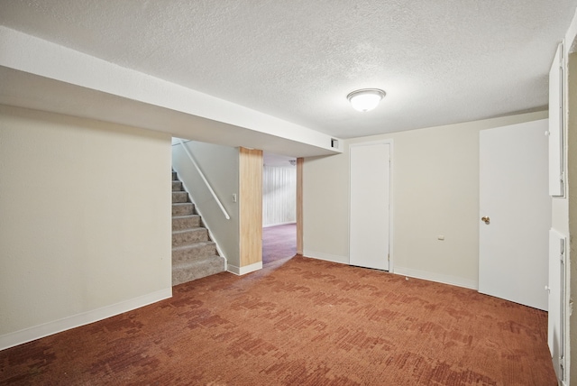 2407 E Tiffin Ave, Des Moines, IA 50317 - finished below grade area with carpet, stairs, a textured ceiling, and baseboards