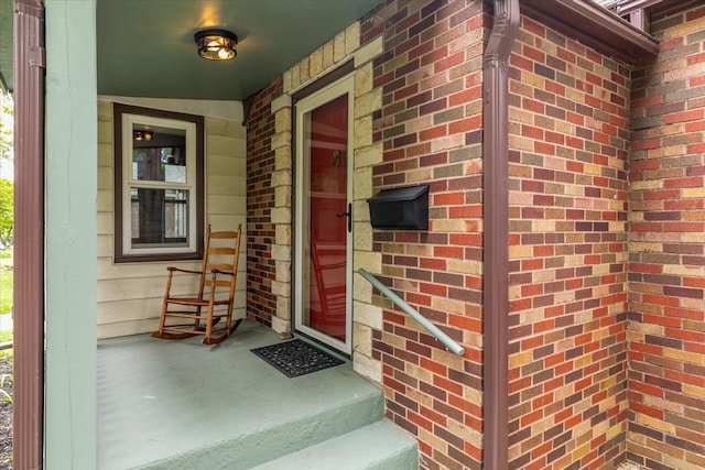 862 40th Pl, Des Moines, IA 50312 - entrance to property with brick siding and a porch