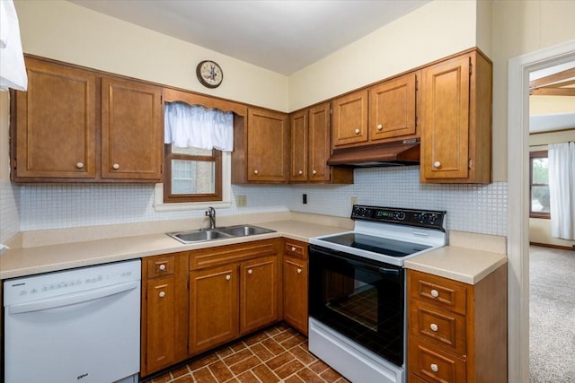 862 40th Pl, Des Moines, IA 50312 - kitchen with white dishwasher, electric stove, under cabinet range hood, a sink, and brown cabinets
