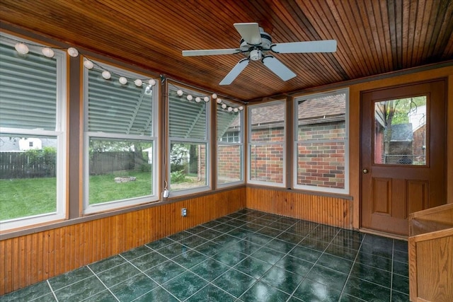 862 40th Pl, Des Moines, IA 50312 - unfurnished sunroom featuring tile patterned flooring, healthy amount of natural light, wooden walls, and wood ceiling