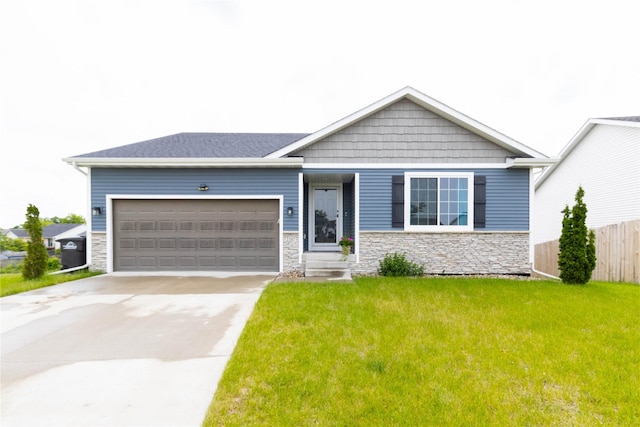 2357 Shadow Creek Cir, Des Moines, IA 50320 - view of front of house featuring stone siding, a garage, and concrete driveway
