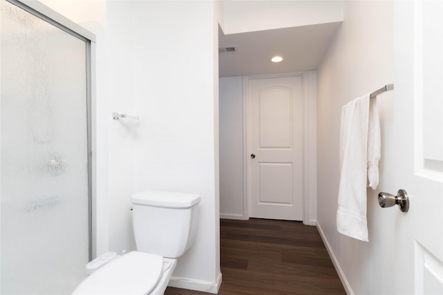 2357 Shadow Creek Cir, Des Moines, IA 50320 - full bath with recessed lighting, a shower stall, wood finished floors, toilet, and baseboards