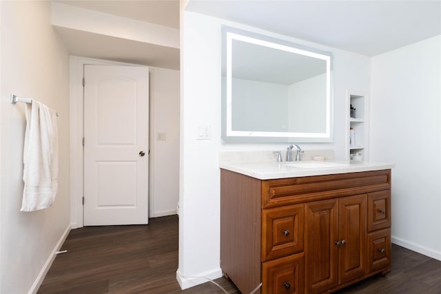 2357 Shadow Creek Cir, Des Moines, IA 50320 - bathroom featuring wood finished floors, vanity, and baseboards