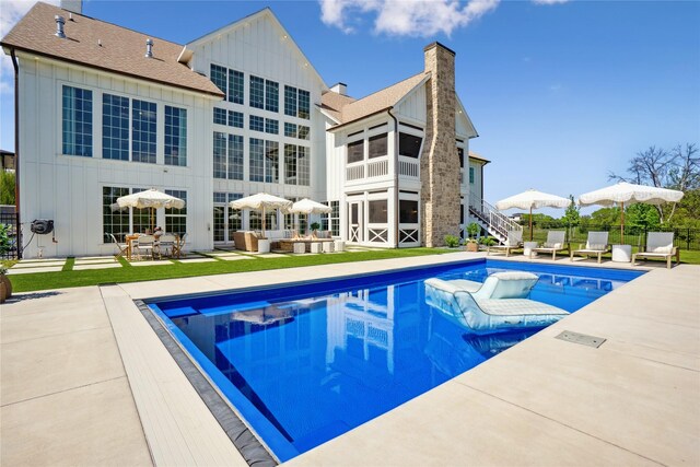 3834 NW 177th Ct, Clive, IA 50325 - view of pool with stairway, a patio, and an outdoor living space