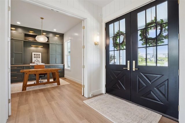 3834 NW 177th Ct, Clive, IA 50325 - foyer entrance with light wood-type flooring, french doors, and baseboards