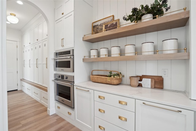 3834 NW 177th Ct, Clive, IA 50325 - kitchen featuring open shelves, white cabinetry, and light wood finished floors