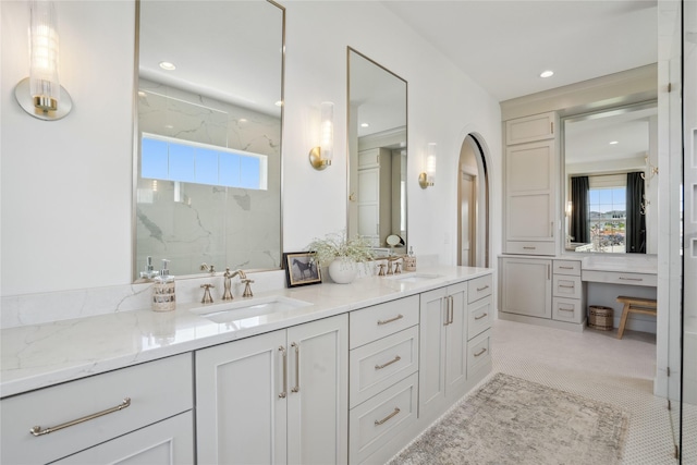 3834 NW 177th Ct, Clive, IA 50325 - full bath featuring double vanity, plenty of natural light, a marble finish shower, and recessed lighting